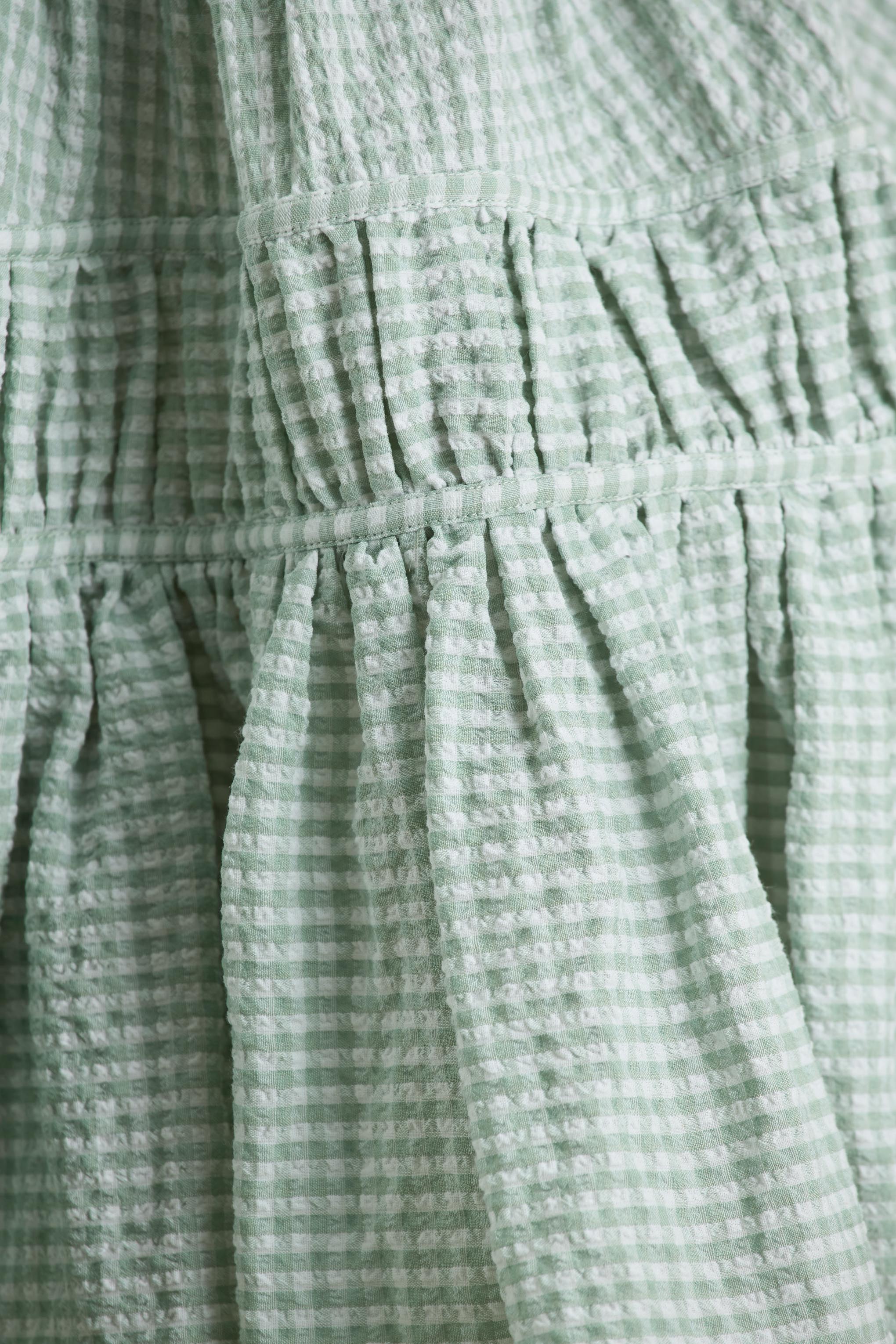 Laurelle | Green Extreme Plunge-Neck Mini Dress With Ruffled Detailing